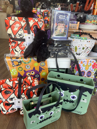 Halloween paper honeycomb decorations with jack-o'-lantern faces in orange and black for ceiling or door decor