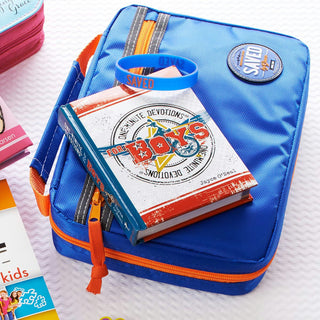 Blue pencil case with books and a blue bandana on a white surface