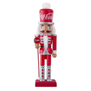 Kurt Adler 10-inch Coca-Cola branded wooden nutcracker in red uniform holding Coke bottle cap scepter