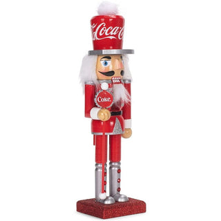 Kurt Adler 10-inch Coca-Cola branded wooden nutcracker figure in red uniform with silver accents