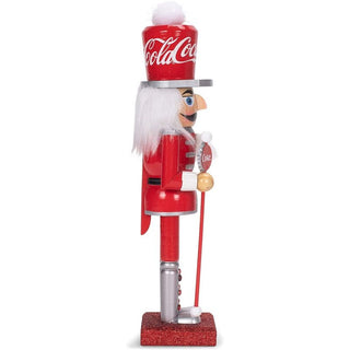 Kurt Adler 10-inch Coca-Cola branded wooden nutcracker soldier with red uniform and white hair