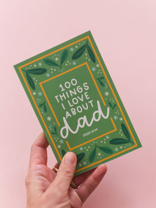 Hand holding a green Pippi Post 100 Things I Love About Dad prompted journal with botanical design