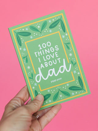 Hand holding a green '100 Things I Love About Dad' prompted journal by Pippi Post