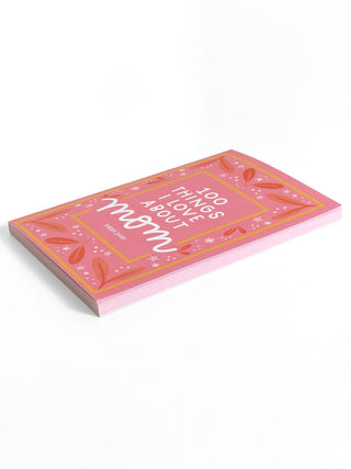 Pink prompted journal titled 100 Things I Love About Mom with floral border design