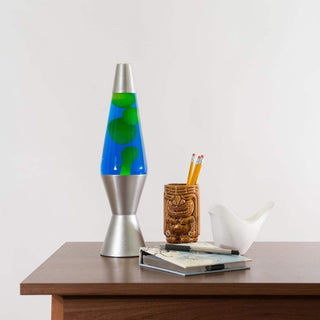 14.5 inch green wax blue liquid lava lamp on dark wood desk with warm glow
