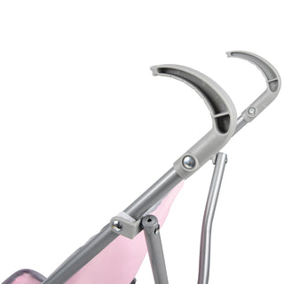 Gray and pink doll stroller handle and folding frame close-up detail