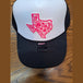 Texas pink on black trucker