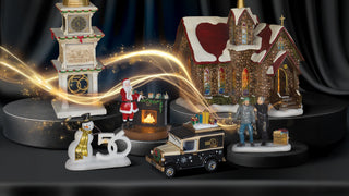 Department 56 Christmas village display with church, clock tower, Santa figure and decorative elements