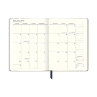 January February 2027 weekly monthly view in navy blue vegan leather planner with cream grid pages