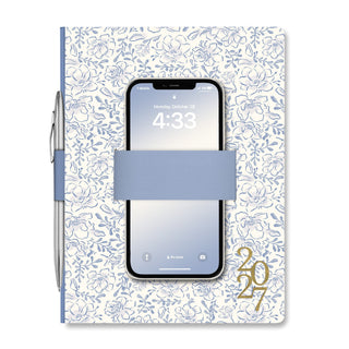 2027 Studio Oh Casey Planner in blue floral print with elastic band holding phone and pen
