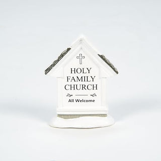 White ceramic Holy Family Church collectible building with cross and brown roof details