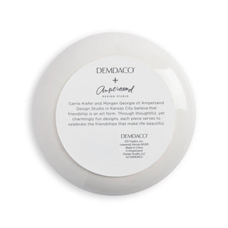 Back of DEMDACO Ampersand Design Studio trinket dish showing brand information and description.