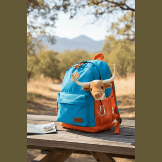 Larry the Texas Longhorn in backpack pocket ready for adventure