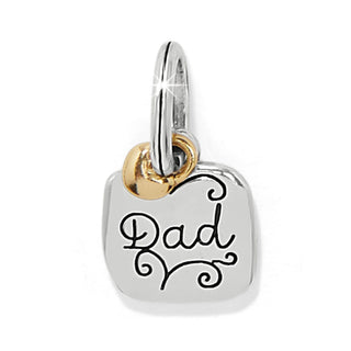 Brighton silver charm with 'Dad' engraved text and gold accent ring on white background