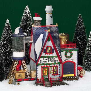 Department 56 Christmas village scene with Real Plastic Snow Factory building and snow-covered trees