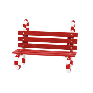 Red wooden miniature bench with candy cane striped legs on white background