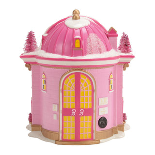 Pink Barbie-themed decorative house with dome roof and yellow lit windows on white background