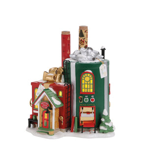 Department 56 Christmas village wrapping paper factory building with snow and gift decorations