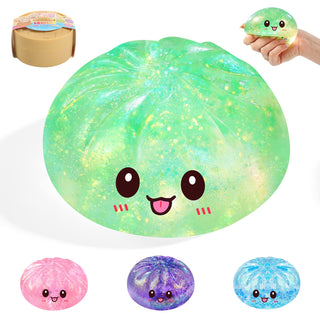 Green sparkly dumpling-shaped squishy fidget toy with cute kawaii face and multiple color variants