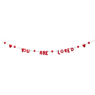 Glory Haus You Are Loved felt letter garland banner with red hearts and colorful pom-poms
