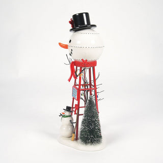 Department 56 Snowman Watertower collectible figurine with red tower structure and Christmas tree