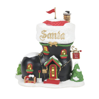 Department 56 Santa's Boot Shop Christmas village piece with snow-covered black boot building