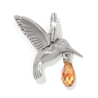 Brighton silver hummingbird charm with amber crystal drop pendant on white background