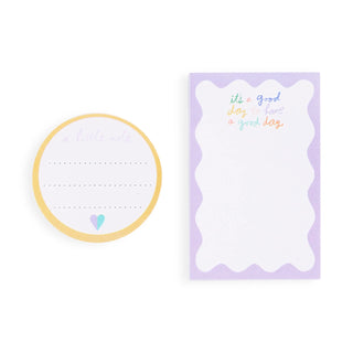 Set of two sticky note pads: circular yellow-bordered note and purple wavy rectangular notepad with inspirational text