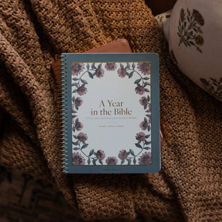 A Year in the Bible Volume 1 spiral-bound study journal with floral cover design