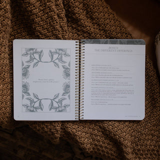 Spiral-bound Bible study open to The Different Offerings bonus section on knit blanket