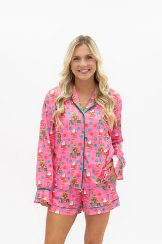 Pink long-sleeve button-up pajama set with Santa Christmas print and shorts