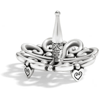 Brighton Alcazar silver ring holder with ornate scrollwork base and heart feet