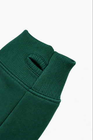 Forest green mock neck sweatshirt cuff detail with thumb hole opening