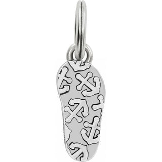 Brighton silver flip flop charm with decorative cross pattern cutouts on white background