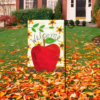 Garden flag with red apple, sunflowers, and Welcome text on cream background