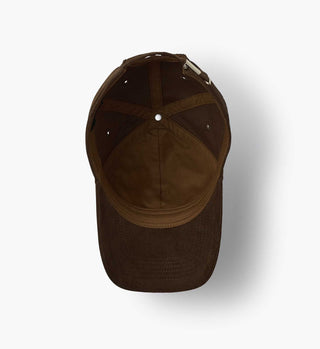 Interior view of brown corduroy baseball cap showing panel construction and adjustable strap