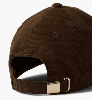 Back view of dark brown corduroy baseball cap with gold metal adjustable closure strap.