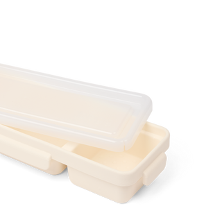Baby Bento Bogg container in Coconut with translucent lid partially open showing compartments