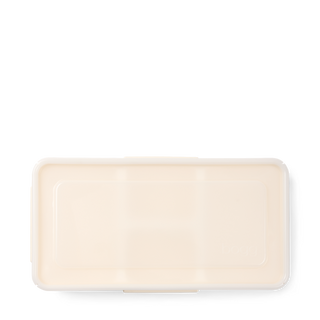 Bottom view of Bogg Bento insert in coconut cream color on white background.