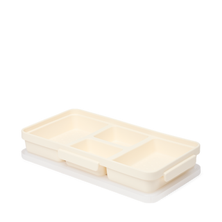 Bogg Bento insert tray in coconut cream color with three divided compartments on white background