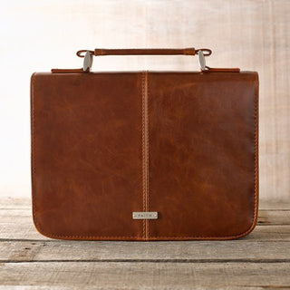 Classic brown faux leather Bible cover with Faith badge and top handle, back view