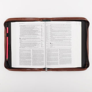 Open Bible in classic brown leather zip cover with pencil holder and pages visible