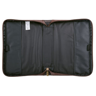 Interior view of brown Bible cover showing black nylon lining, pockets, and cross zipper pull