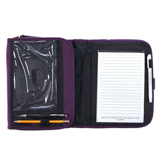 Open purple Bible cover organizer showing notepad, pen holder, clear zipper pocket, and pencils