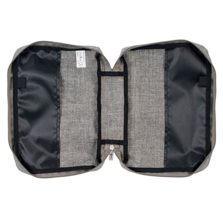 Interior view of gray Bible cover showing elastic straps, zipper pocket, and spacious compartment