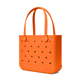 Bogg Bag Baby tote in orange with pumpkin-shaped ventilation holes and double handles