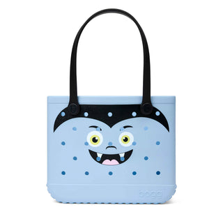 Bogg Bag Baby tote in light blue with vampire face graphic and black handles