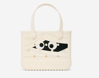 Bogg Bag Bitty tote in cream with Halloween mummy face graphic