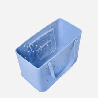 Interior view of light blue Bogg Bag with clear polka-dot pouch organizer