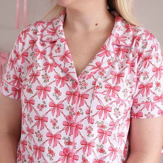 Pink piping and three button placket detail on bow print pajama top